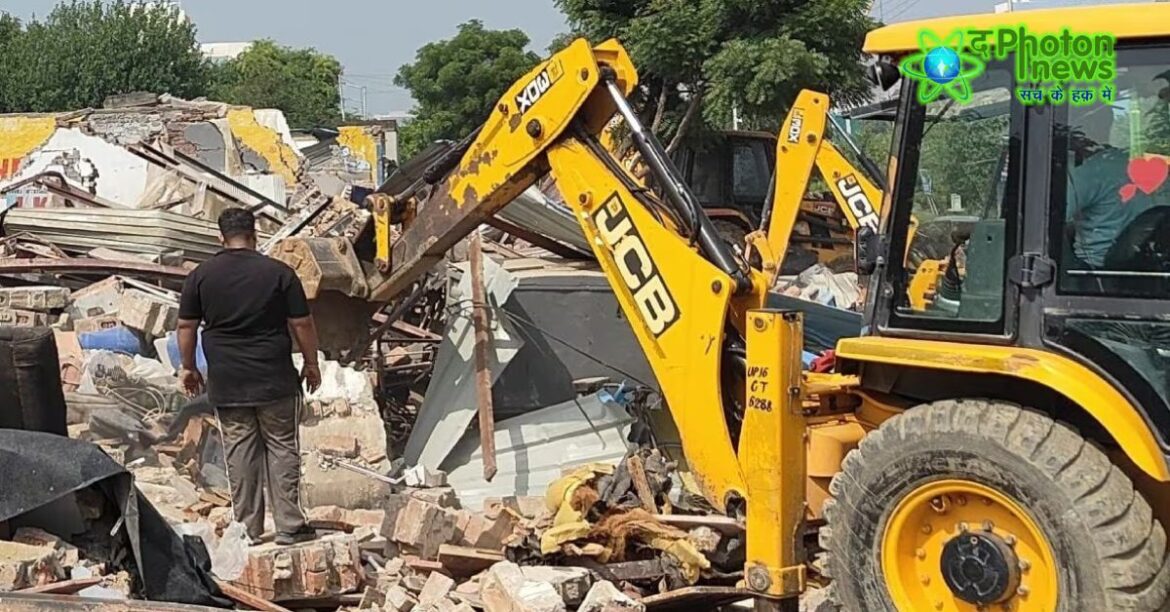 Bulldozer demolishing illegal structures in Jamshedpur during encroachment drive