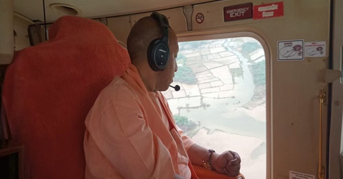 CM Yogi Adityanath distributing flood relief materials in Auraiya, UP