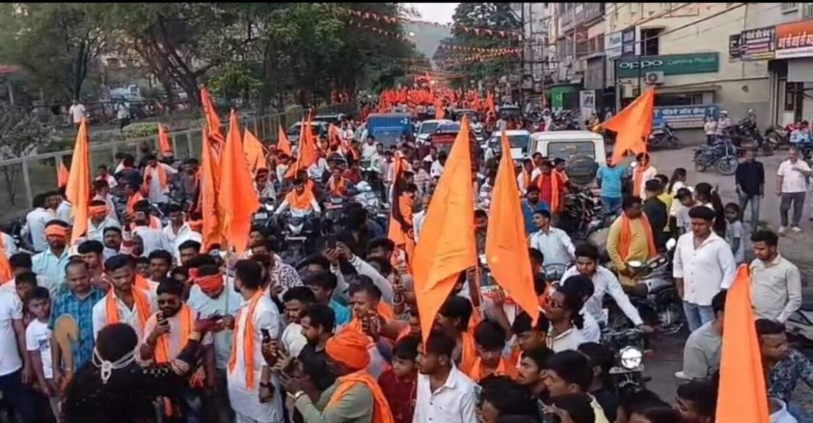 Hindu New Year procession in Jamshedpur with devotees dressed in saffron and flags across the city
