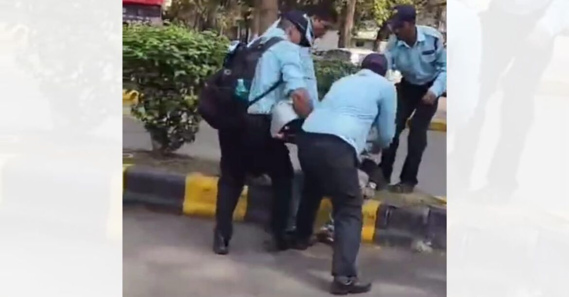 Security guards assaulting youth at Tata Main Hospital gate in Jamshedpur