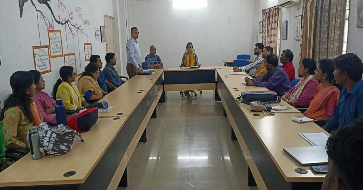 Kolhan University IQAC meeting with officials reviewing departmental reports in Chaibasa